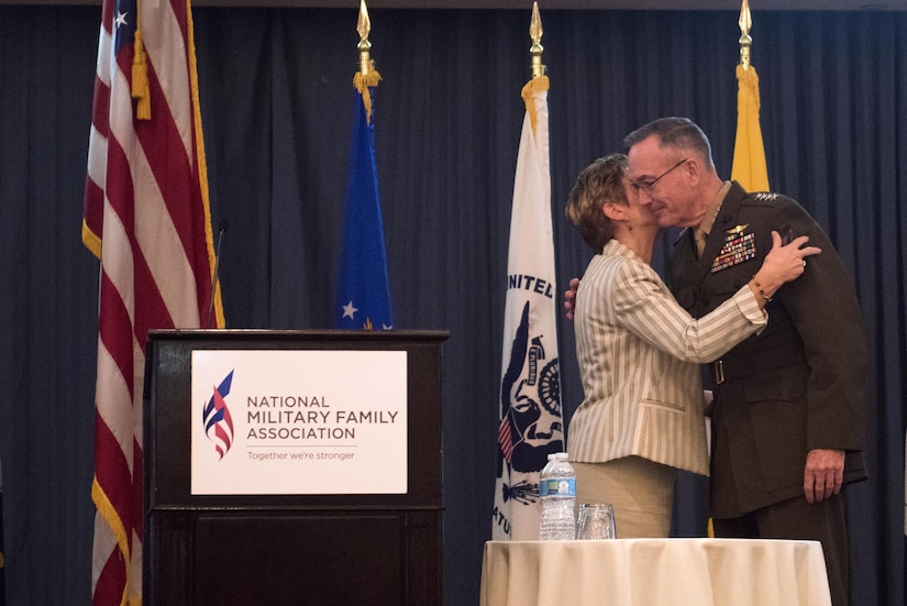 Ellyn Dunford kisses her husband, Chairman of the Joint Chiefs of Staff Marine Corps Gen. Joseph F. Dunford Jr., after introducing him to speak at the 2016 National Military Family Association Leadership Luncheon in Arlington, Va., Oct. 11, 2016. DoD photo by D. Myles Cullen