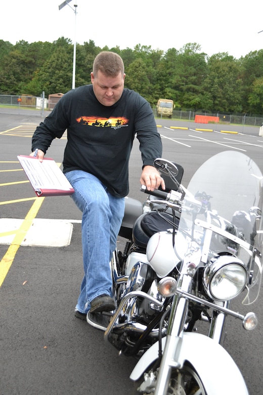 Sgt. 1st Class Eric Baker, motorcycle mentor for the 80th Training Command (TASS), goes through a motorcycle safety checklist at the command's Family Programs Center in Richmond, Va., as he prepares for the motorcycle mentorship ride in honor of Sgt. Scott McGinnis on Oct. 6, 2016. McGinnis, 22, died in a motorcycle accident July 4, 2016 in Centre, Ala., where he was struck by another vehicle.