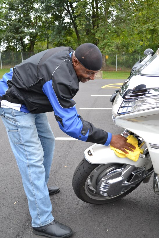 Master Sgt. Gregory Moody, contracting officer representative for the 80th Training Command (TASS), doesn't miss a spot cleaning his motorcycle at the command's Family Programs Center in Richmond, Va., as he prepares for the motorcycle mentorship ride in honor of Sgt. Scott McGinnis on Oct. 6, 2016. McGinnis, 22, died in a motorcycle accident July 4, 2016 in Centre, Ala., where he was struck by another vehicle.