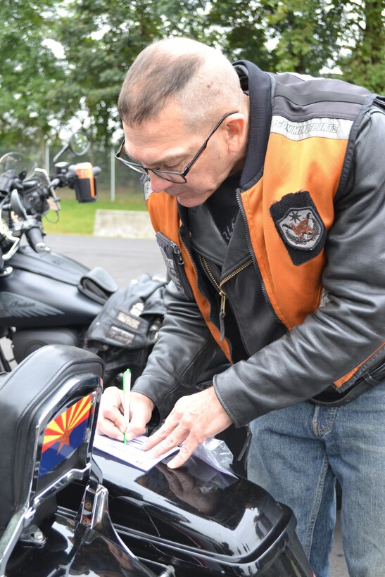 Master Sgt. Stuart Peters, maintenance supervisor for the 80th Training Command (TASS), checks everything on his motorcycle at the command's Family Programs Center in Richmond, Va., as he prepares for the motorcycle mentorship ride in honor of Sgt. Scott McGinnis on Oct. 6, 2016. McGinnis, 22, died in a motorcycle accident July 4, 2016 in Centre, Ala., where he was struck by another vehicle.