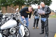 (Left to right) Sgt. 1st Class Eric Baker, Sgt. 1st Class David Mangan and Maj. Stephen Yarber, of the 80th Training Command (TASS), conduct motorcycle safety checks at the command's Family Programs Center in Richmond, Va., as they prepare for the motorcycle mentorship ride in honor of Sgt. Scott McGinnis on Oct. 6, 2016. McGinnis, 22, died in a motorcycle accident July 4, 2016 in Centre, Ala., where he was struck by another vehicle.