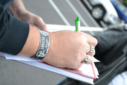 Sgt. 1st Class Eric Baker, motorcycle mentor for the 80th Training Command (TASS), checks off each item on his safety checklist at the command's Family Programs Center in Richmond, Va., as he prepares for the motorcycle mentorship ride in honor of Sgt. Scott McGinnis on Oct. 6, 2016. McGinnis, 22, died in a motorcycle accident July 4, 2016 in Centre, Ala., where he was struck by another vehicle.