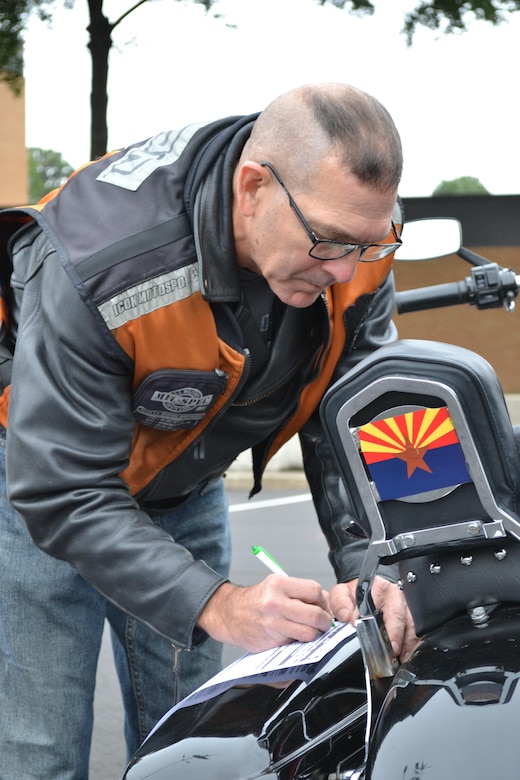 Master Sgt. Stuart Peters, maintenance supervisor for the 80th Training Command (TASS), checks off each item on his safety checklist at the command's Family Programs Center in Richmond, Va., as he prepares for the motorcycle mentorship ride in honor of Sgt. Scott McGinnis on Oct. 6, 2016. McGinnis, 22, died in a motorcycle accident July 4, 2016 in Centre, Ala., where he was struck by another vehicle.