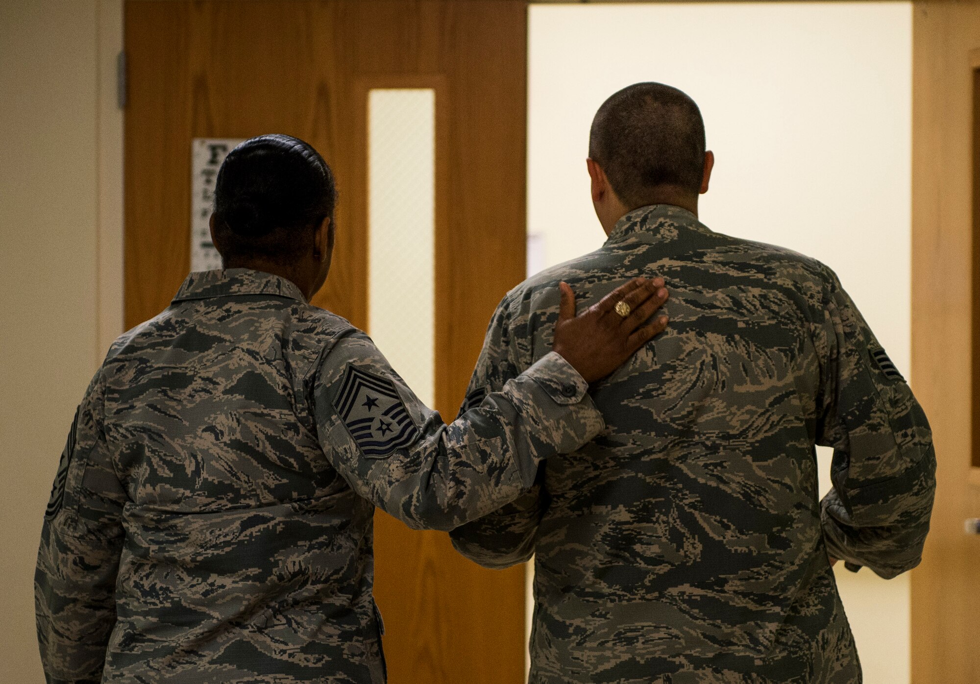 Air Mobility Command Command Chief Master Sgt. Frey is escorted around the 375th Medical Group. During her visit, she said she was impressed with the wing’s ICE Airmen and the culture of “Innovation, Communication and Excellence.” (U.S. Air Force photo/Staff Sgt. Jodi Martinez)