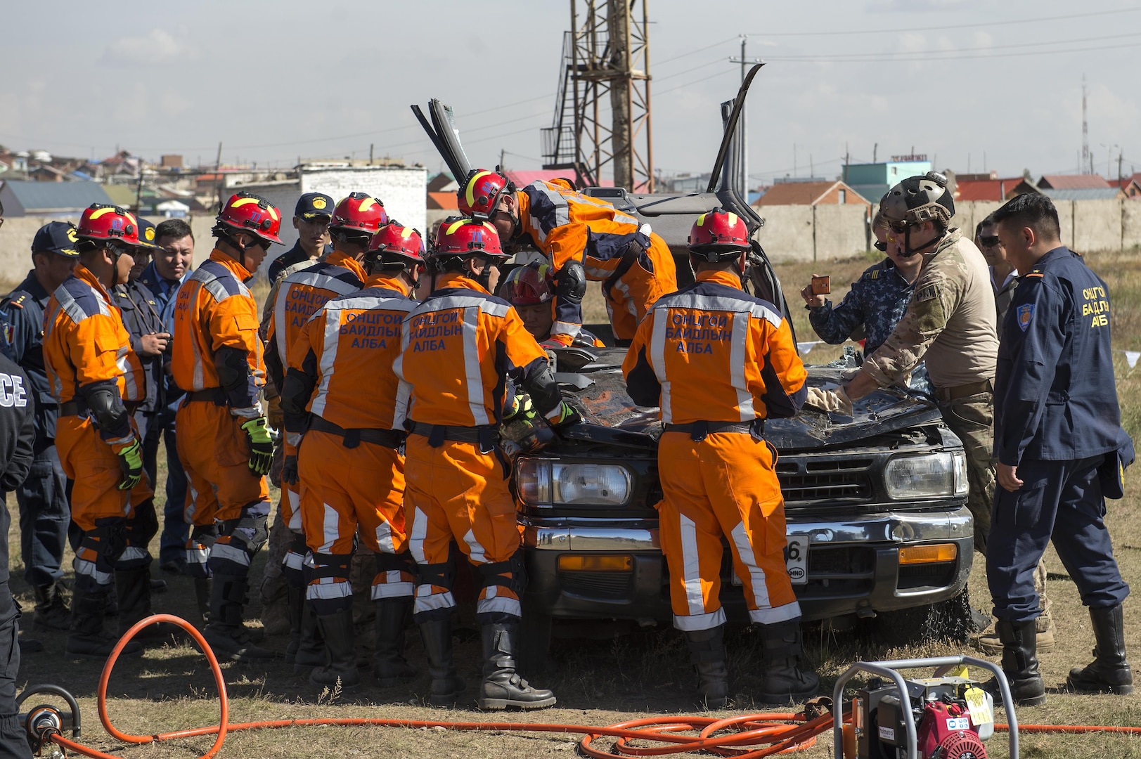 Mongolian emergency management personnel practice vehicle extrication techniques with members of the U.S. Air Force during a Disaster Management Leadership Seminar in Ulaanbaatar, Mongolia, Sept. 21, 2016. The five-day seminar is a subject matter expert exchange between the U.S. and Mongolia. The Mongolia National Emergency Management Agency hosted the exchange, partnering with U.S. service members from Special Operations Command, Pacific. 