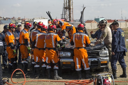 Mongolian emergency management personnel practice vehicle extrication techniques with members of the U.S. Air Force during a Disaster Management Leadership Seminar in Ulaanbaatar, Mongolia, Sept. 21, 2016. The five-day seminar is a subject matter expert exchange between the U.S. and Mongolia. The Mongolia National Emergency Management Agency hosted the exchange, partnering with U.S. service members from Special Operations Command, Pacific. 