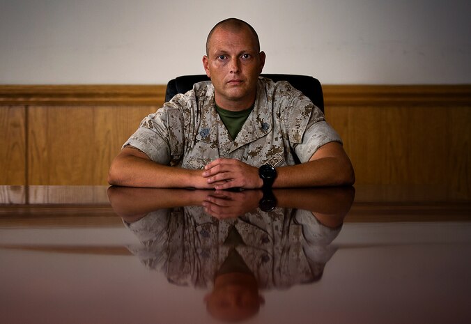 Gunnery Sgt. John J. Ulmer, 39 — Milton, Pennsylvania
I was at Marine Corps Base Quantico when the first plane hit the tower.
Everyone thought it was an accident — a civilian plane had maybe gone off course. I can remember going to the duty hut and watching it live on TV.
About 45 minutes later the second one hit, and that’s when reality struck us. This was not an accident.
At first, I was shocked. I didn’t think anything like that could happen. Anger and frustration set in once we realized what had actually happened.
I joined in 1998, so I really think after this, things became a lot more real; we’re here to do a certain job. This isn’t peacetime any more.
I used to drive a general officer to the Pentagon. I used to drop the General off at the helo pad near the old Navy Annex at Henderson Hall and wait, and I can remember watching planes fly over the Pentagon going to Reagan thinking to myself “Wow, wouldn’t it be crazy if one of them ran into the Pentagon?” Never thought it would happen. The spot I parked at was probably 50 feet from where it hit the Pentagon.
I was a recruiter from ’05 to ’08, and you saw men and women who really could do whatever they wanted to do with their life, but they chose to serve their country because of 9/11. I think we’ve evolved as an organization for the better. 