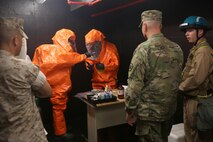 Marines with Identification and Detection Platoon, Chemical Biological Incident Response Force (CBIRF), show Army Maj. Gen. Richard Gallant, commander of Joint Task Force Civil Support, how they collect samples of chemical agents during an official visit at Naval Annex Stump Neck, Md., Sept. 29, 2016. Gallant visited CBIRF’s own training site the Downey Responder Training Facility to learn more about the Marines and sailors with CBIRF, their training and operational capabilities,  and the equipment they use for chemical, biological, radiological, nuclear and high-yield explosive (CBRNE) crisis response and consequence management. (Official U.S. Marine Corps photo by Sgt. Jonathan Herrera/Released)