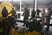 Marine Sgt. Sawyer Guerin, a team leader with Decontamination Platoon, Chemical Biological Incident Response Force (CBIRF), explains to Army Maj. Gen. Richard Gallant, commander of Joint Task Force Civil Support, how CBIRF Marines take casualties through non-ambulatory decontamination while other Marines demonstrate that process during an official visit at Naval Annex Stump Neck, Md., Sept. 29, 2016. Gallant visited CBIRF’s own training site the Downey Responder Training Facility to learn more about the Marines and sailors with CBIRF, their training capabilities,  and the equipment they use for chemical, biological, radiological, nuclear and high-yield explosive (CBRNE) crisis response and consequence management. (Official U.S. Marine Corps photo by Sgt. Jonathan Herrera/Released)