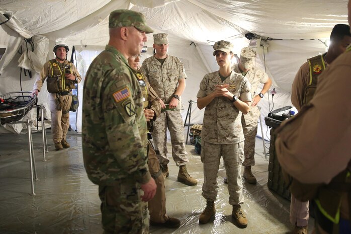Cmdr. Tina Sauter, senior medical officer with Chemical Biological Incident Response Force (CBIRF), explains to Army Maj. Gen. Richard Gallant, commander of Joint Task Force Civil Support, the process of how CBIRF medical personnel triage contaminated casualties during a crisis as part of an official visit at Naval Annex Stump Neck, Md., Sept. 29, 2016. Gallant visited CBIRF’s own training site the Downey Responder Training Facility to learn more about the Marines and sailors with CBIRF, their training capabilities,  and the equipment they use for chemical, biological, radiological, nuclear and high-yield explosive (CBRNE) crisis response and consequence management. (Official U.S. Marine Corps photo by Sgt. Jonathan Herrera/Released)