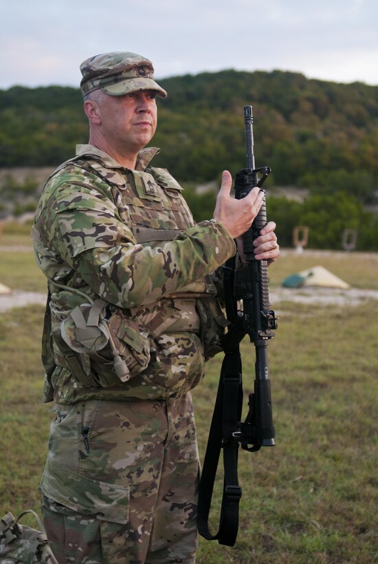 Mater Sgt. Keith Buchanan, an Army Reserve Soldier with the 316th Sustainment Command (Expeditionary), based out of Coraopolis, Pa., briefs Soldiers on the M4 carbine before they enter a range at Fort Hood, Tx., Oct. 9, 2016. This is to prepare the Soldiers of the 316th during their predeployment training. (U.S. Army photo by Staff Sgt. Dalton Smith / Released)