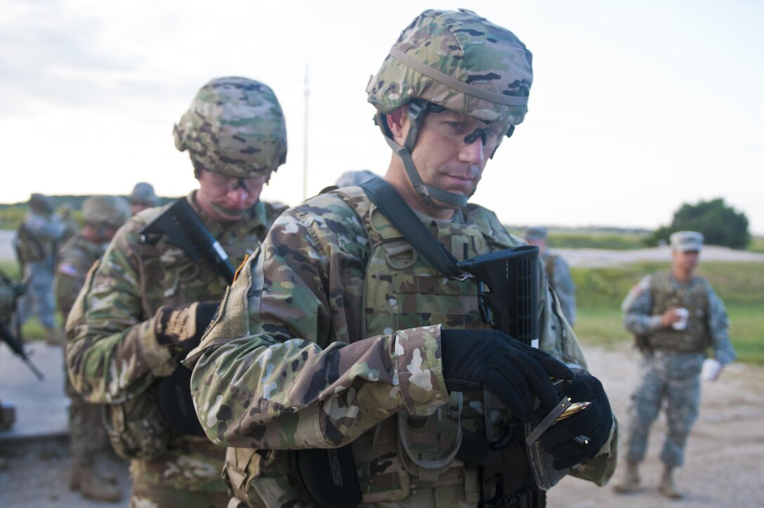 1st Lt. Mark Ray, an Army Reserve Soldier with the 316th Sustainment Command (Expeditionary), based out of Coraopolis, Pa., loads his magazine to qualify with his M4 carbine at Fort Hood, Tx., Oct. 9, 2016. This is to prepare the Soldiers of the 316th during their predeployment training. (U.S. Army photo by Staff Sgt. Dalton Smith / Released)