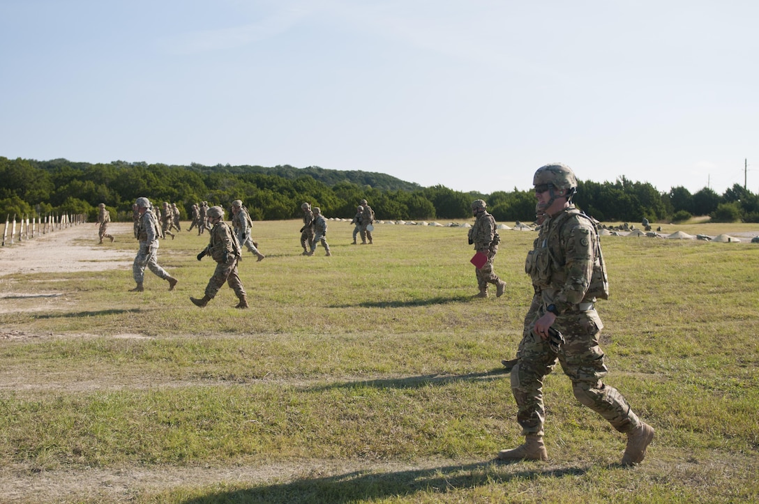 Army Reserve Soldiers with the 316th Sustainment Command (Expeditionary), based out of Coraopolis, Pa., march down range to look at their targets during the M4 carbine qualification day at Fort Hood, Tx., Oct. 9, 2016. This is to prepare the Soldiers of the 316th during their predeployment training. (U.S. Army photo by Staff Sgt. Dalton Smith / Released)