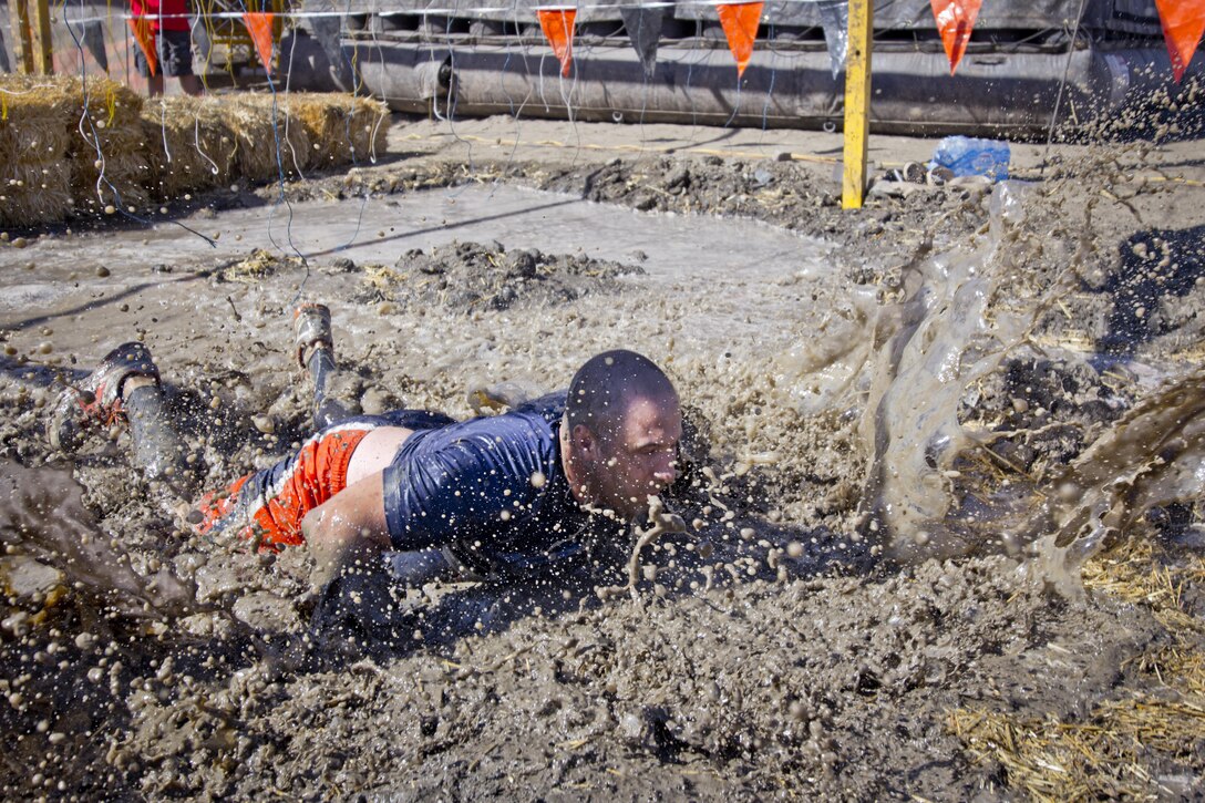 LAKE ELSINORE- Calif. (October 8, 2016) - The Army Reserve is a sponsor for the Southern California Tough Mudder, where participants run a basic-training like course over ten miles long with 22 different team obstacles. “Tough Mudder is a great recruiting and retention event because it is an opportunity for civilians to interact with Soldiers and see that the Army is here to support local communities in both good times and bad,” said Master Sgt. Shadonika Crawford, 650th Regional Support Group. 

(US Army photo by Cpl. Timothy Yao)