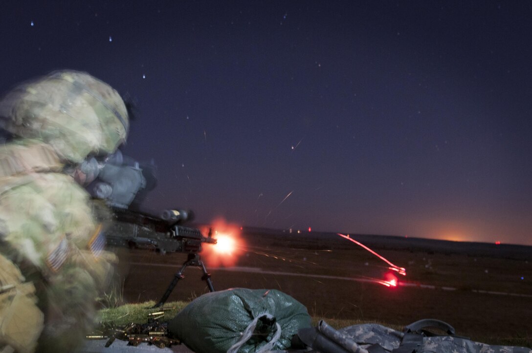 Spc. Jordan Fitzgerald, an Army Reserve Soldier with the 316th Sustainment Command (Expeditionary), based out of Coraopolis, Pa., fires a M240B machine gun during night qualification at Fort Hood, Tx., Oct. 10, 2016. This is to prepare the Soldiers of the 316th during their predeployment training. (U.S. Army photo by Staff Sgt. Dalton Smith)