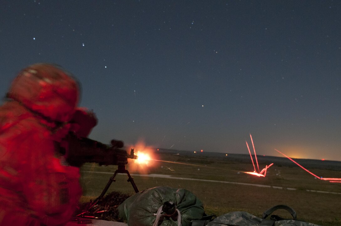 Cpt. Michael Webb, an Army Reserve Soldier with the 316th Sustainment Command (Expeditionary), based out of Coraopolis, Pa., fires a M240B machine gun during night qualification at Fort Hood, Tx., Oct. 10, 2016. This is to prepare the Soldiers of the 316th during their predeployment training. (U.S. Army photo by Staff Sgt. Dalton Smith)