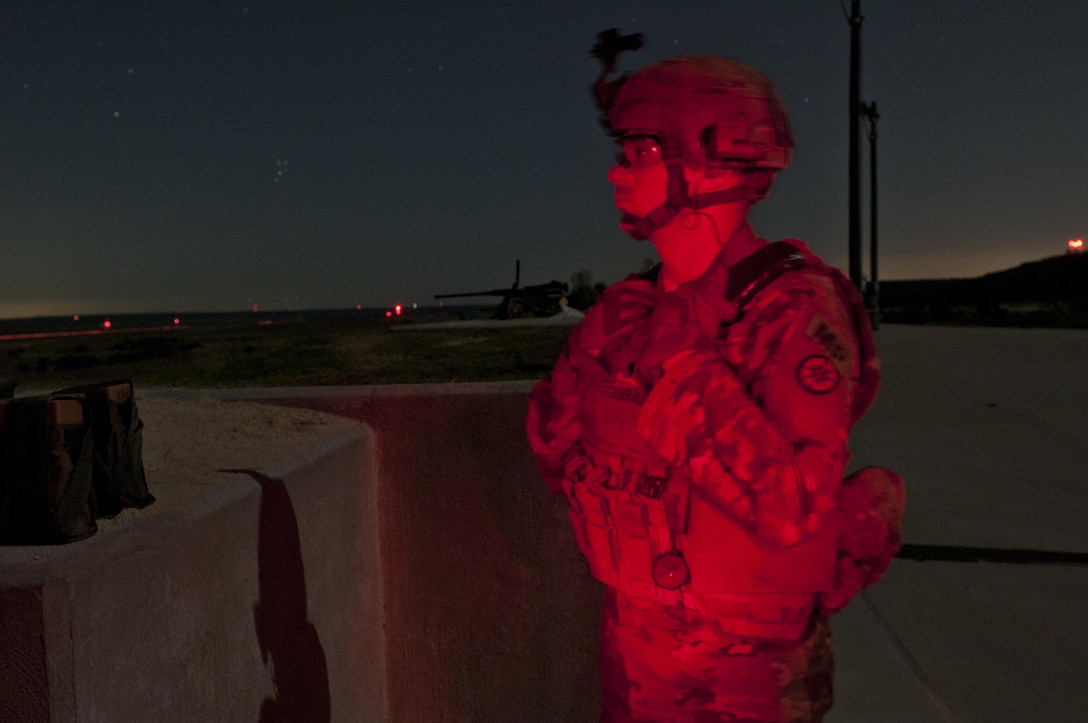 Spc. Jordan Fitzgerald, an Army Reserve Soldier with the 316th Sustainment Command (Expeditionary), based out of Coraopolis, Pa., observes Soldiers firing their M240B machine guns during night qualification at Fort Hood, Tx., Oct. 10, 2016. This is to prepare the Soldiers of the 316th during their predeployment training. (U.S. Army photo by Staff Sgt. Dalton Smith)