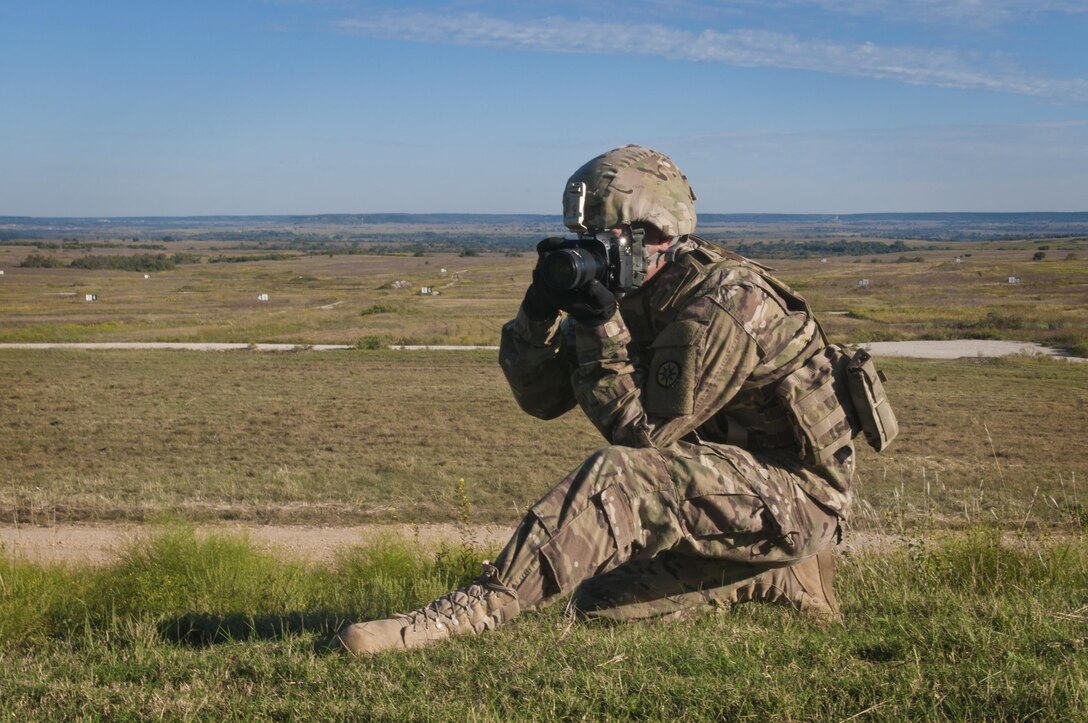 Sgt. Christopher Bigelow, a public affairs noncommissioned officer with the 316th Sustainment Command (Expeditionary), based out of Coraopolis, Pa., documents Soldiers qualifying on the M2 machine gun at Fort Hood, Tx., Oct. 9, 2016. (U.S. Army photo by Staff Sgt. Dalton Smith)