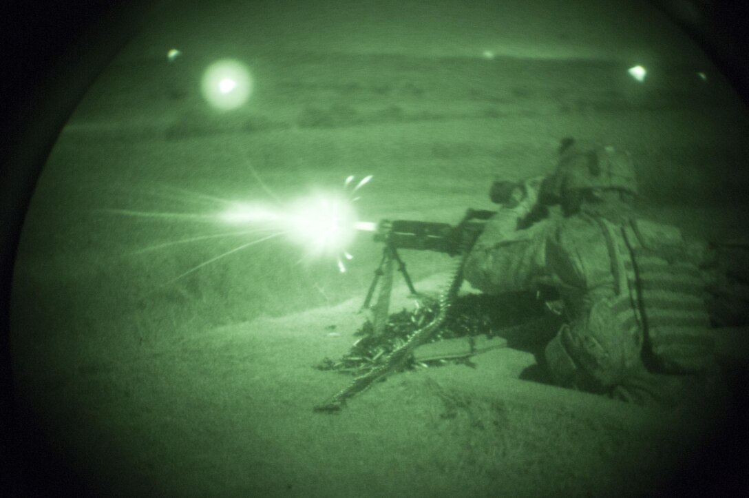 Spc. Jordan Fitzjerald, a military police officer with the 316th Sustainment Command (Expeditionary), an Army Reserve unit from Coraopolis, Pa., fires a M240B machine gun during a night qualification exercise as a part of the pre-deployment training 316th ESC Soldiers are receiving at Fort Hood, Tx., Oct. 10, 2016. (U.S. Army photo by Sgt. Christopher Bigelow)