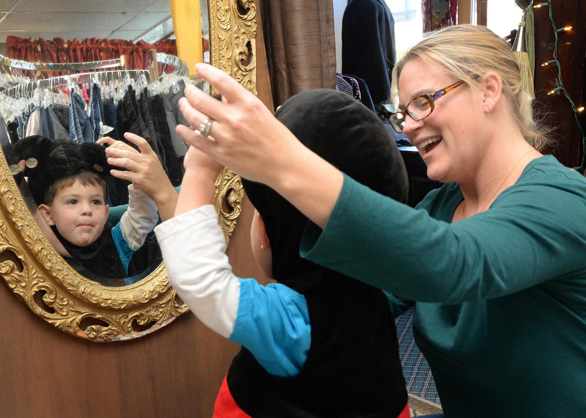 Ashley Chaney helps her son, Marshall, age 2, with trying on a Halloween costume at the Minuteman Thrift Store on base Oct. 11. The thrift store, which is managed by the Hanscom Spouses Club, is open Tuesday and Thursday from 9:30 a.m. to 1:30 p.m., as well as the first Saturday of month from 9:30 a.m. to 1:30 p.m. (U.S. Air Force photo by Linda LaBonte Britt)