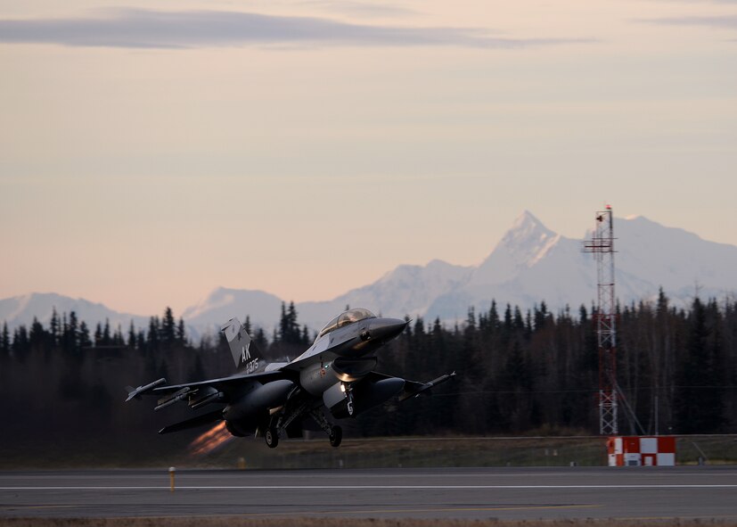 A U.S. Air Force F-16 Fighting Falcon assigned to the 18th Aggressor Squadron takes off from Eielson Air Force Base, Alaska, with afterburners engaged Oct. 10, 2016, for the first combat training mission of RED FLAG-Alaska (RF-A) 17-1. The average Aggressor pilot has at least 1,000 fighter hours and hundreds of hours of studying to become experts in enemy tactics used to train U.S. Air Force, joint and coalition partners during U.S. Pacific Air Forces commander-directed RF-A exercises. (U.S. Air Force photo by Master Sgt. Karen J. Tomasik)