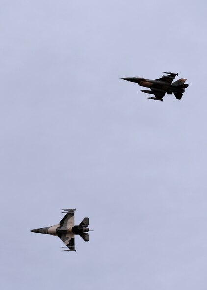 A pair of U.S. Air Force F-16 Fighting Falcons assigned to the 18th Aggressor Squadron fly over Eielson Air Force Base, Alaska, after returning from the Oct. 10, 2016, morning sortie during RED FLAG-Alaska (RF-A) 17-1. Aggressor pilots train U.S., joint and international partners during RF-A, a series of Pacific Air Forces commander-directed field training exercises, enabling units to sharpen their skills and strengthen interoperability by flying simulated combat sorties in a realistic threat environment inside the Joint Pacific Alaska Range Complex, the largest instrumented air, ground and electronic combat training range in the world. (U.S. Air Force photo by Master Sgt. Karen J. Tomasik)