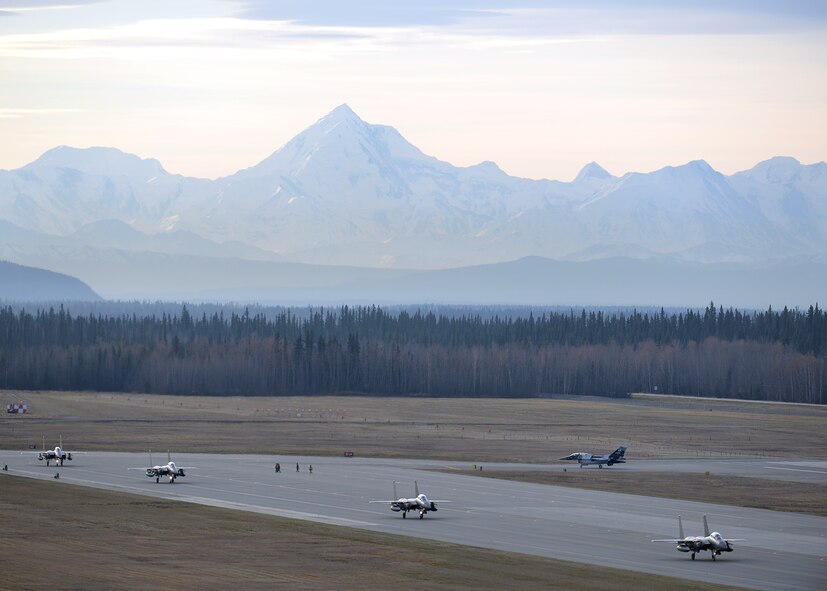 Republic of Korea Air Force (ROKAF) F-15K Slam Eagle multi-role fighter aircraft taxi toward their ramp space on the Eielson Air Force Base, Alaska, flight line Oct. 10, 2016, as a U.S. Air Force F-16 Fighting Falcon assigned to the 18th Aggressor Squadron taxis toward its hangar after the two opposing forces wrapped up their first RED FLAG-Alaska (RF-A) 17-1 combat training mission. RF-A is a series of Pacific Air Forces commander-directed field training exercises vital to maintaining peace and stability in the Indo-Asia-Pacific region, and providing U.S. units and partner nation forces like the ROKAF the opportunity to sharpen their combat skills and strengthen interoperability in a realistic threat environment. (U.S. Air Force photo by Master Sgt. Karen J. Tomasik)