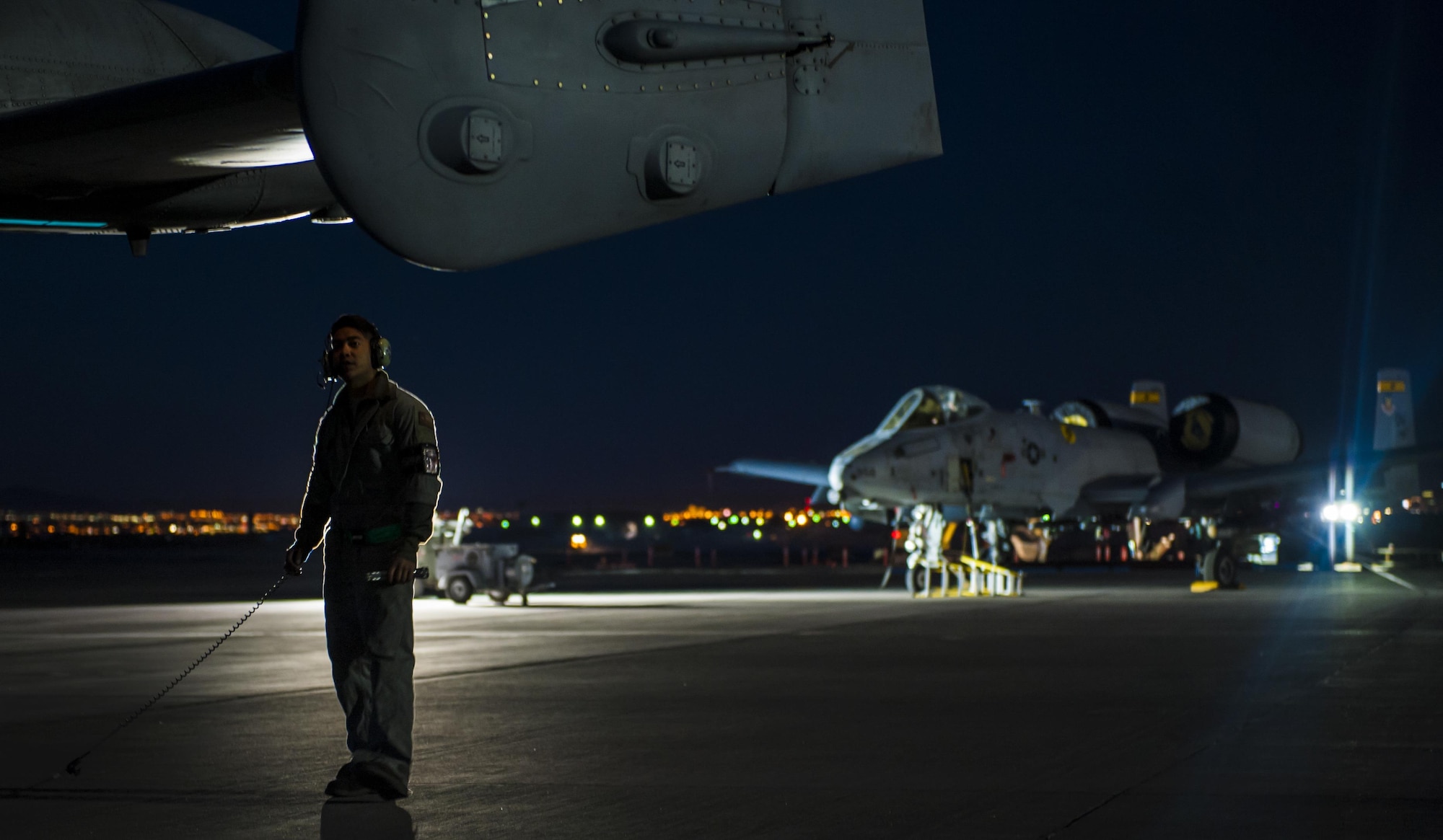 Senior Airman Scott Martinez, 355th Aircraft Maintenance Squadron crew chief, Davis-Monthan Air Force Base, Ariz., performs pre-flight checks to make sure the tail rudders of an A-10 Thunderbolt operate properly before takeoff at Nellis Air Force Base, Nev., Oct. 4, 2016. The Thunderbolt II can employ a wide variety of conventional munitions, including general purpose bombs, cluster bomb units, laser guided bombs, and joint direct attack munitions. (U.S. Air Force photo by Airman 1st Class Kevin Tanenbaum/Released)