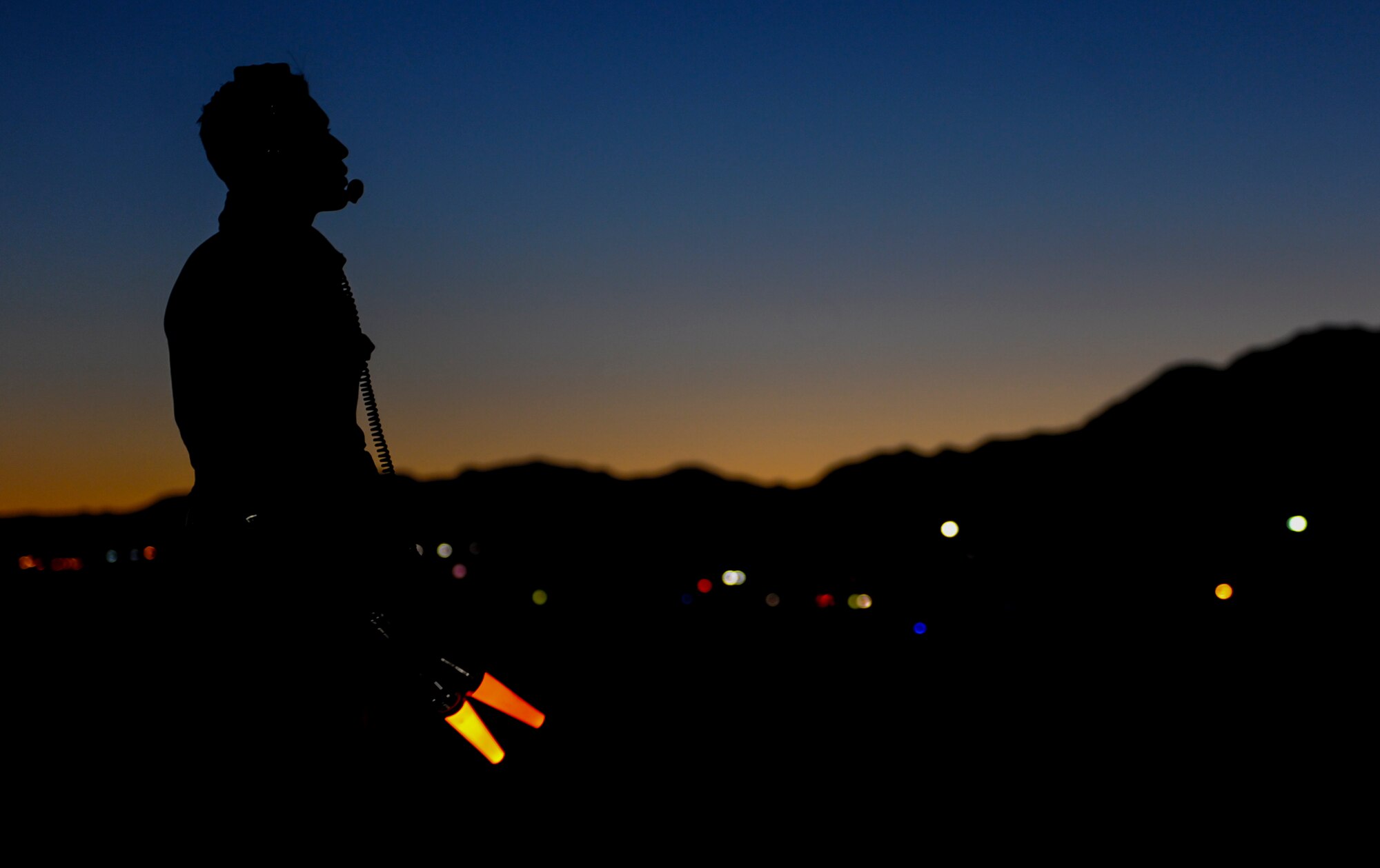 Senior Airman Scott Martinez, 355th Aircraft Maintenance Squadron crew chief, Davis-Monthan Air Force Base, Ariz., signals to an A-10 Thunderbolt II pilot during takeoff at Nellis Air Force Base, Nev., Oct. 4, 2016. The wide combat radius and short takeoff and landing capability of the A-10 permit operations in and out of locations near front lines. (U.S. Air Force photo by Airman 1st Class Kevin Tanenbaum/Released)