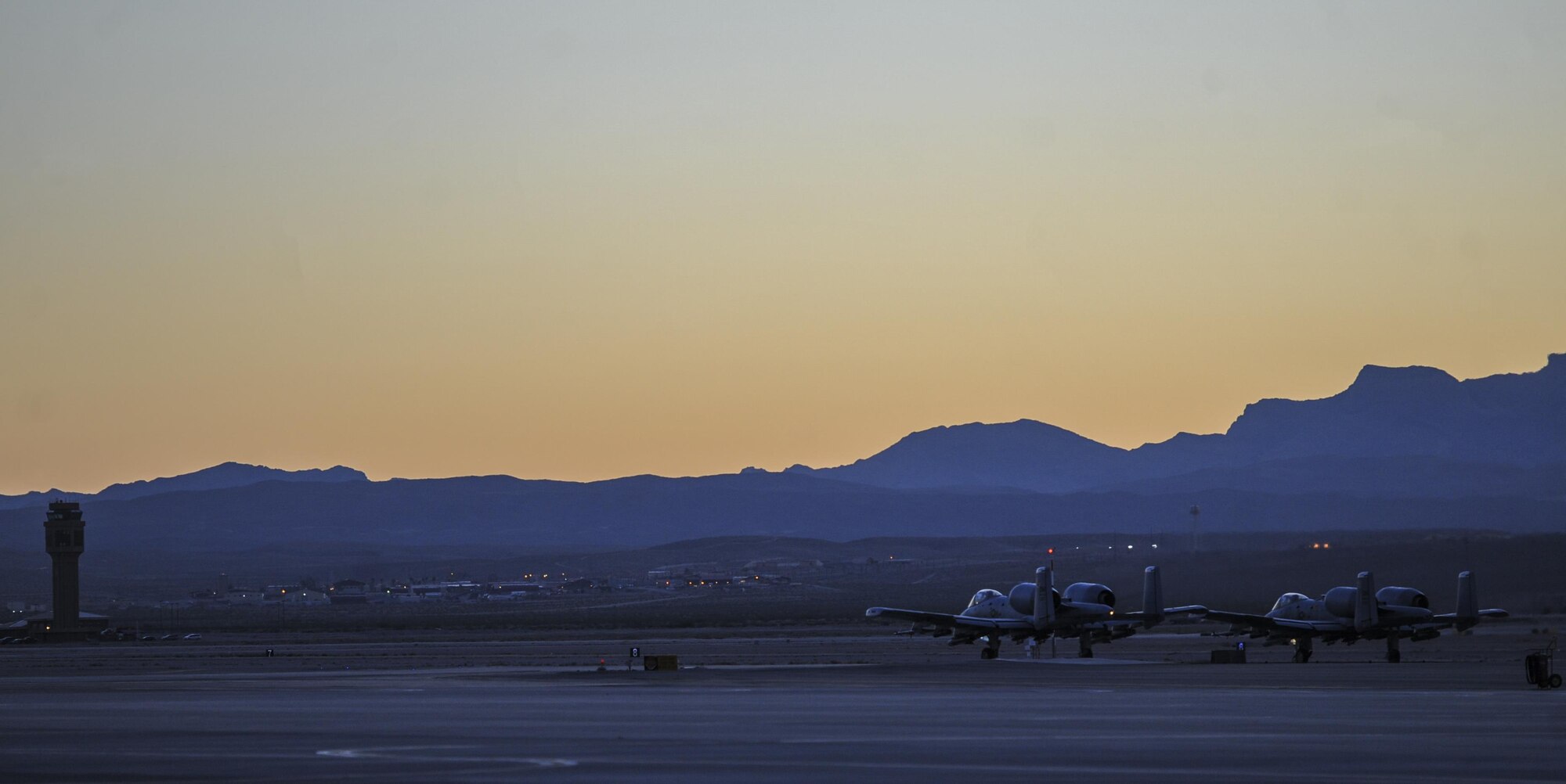 Two A-10 Thunderbolt II assigned to 357th Fighter Squadron, Davis-Monthan Air Force Base, Ariz., wait to takeoff at Nellis Air Force Base, Nev., Oct. 4, 2016. The A-10 can loiter near battle areas for extended periods of time and operate in low ceiling and visibility conditions. (U.S. Air Force photo by Airman 1st Class Kevin Tanenbaum/Released)