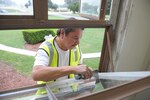 Eddie Contreras glazes a window at the Joint Base San Antonio-Randolph Taj Mahal, during its renovation process Oct. 6, 2016.  The renovation is part of a $10 million project designed the improve the Taj Mahal, which houses the headquarters for the 12th Flying Training Wing and the 12th Mission Support Group.  
