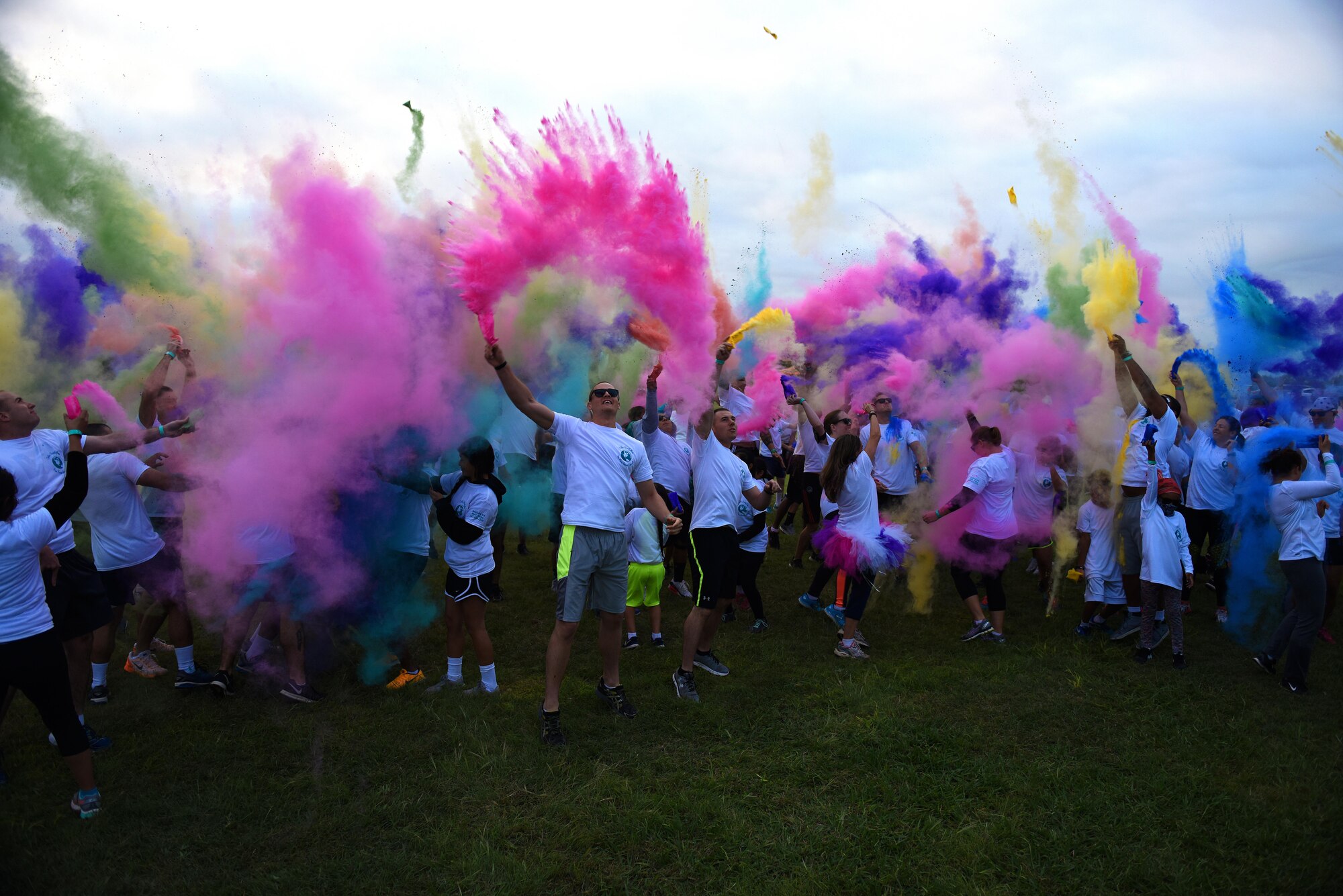 Participants during the annual Sexual Assault Prevention and Response Color Run create a ‘color explosion’ near the Kiowa Trail on Goodfellow Air Force Base, Texas, Oct. 8, 2016. The SAPR office hosted the event to help bring awareness to sexual assault. (U.S. Air Force photo by Airman 1st Class Caelynn Ferguson/Released)