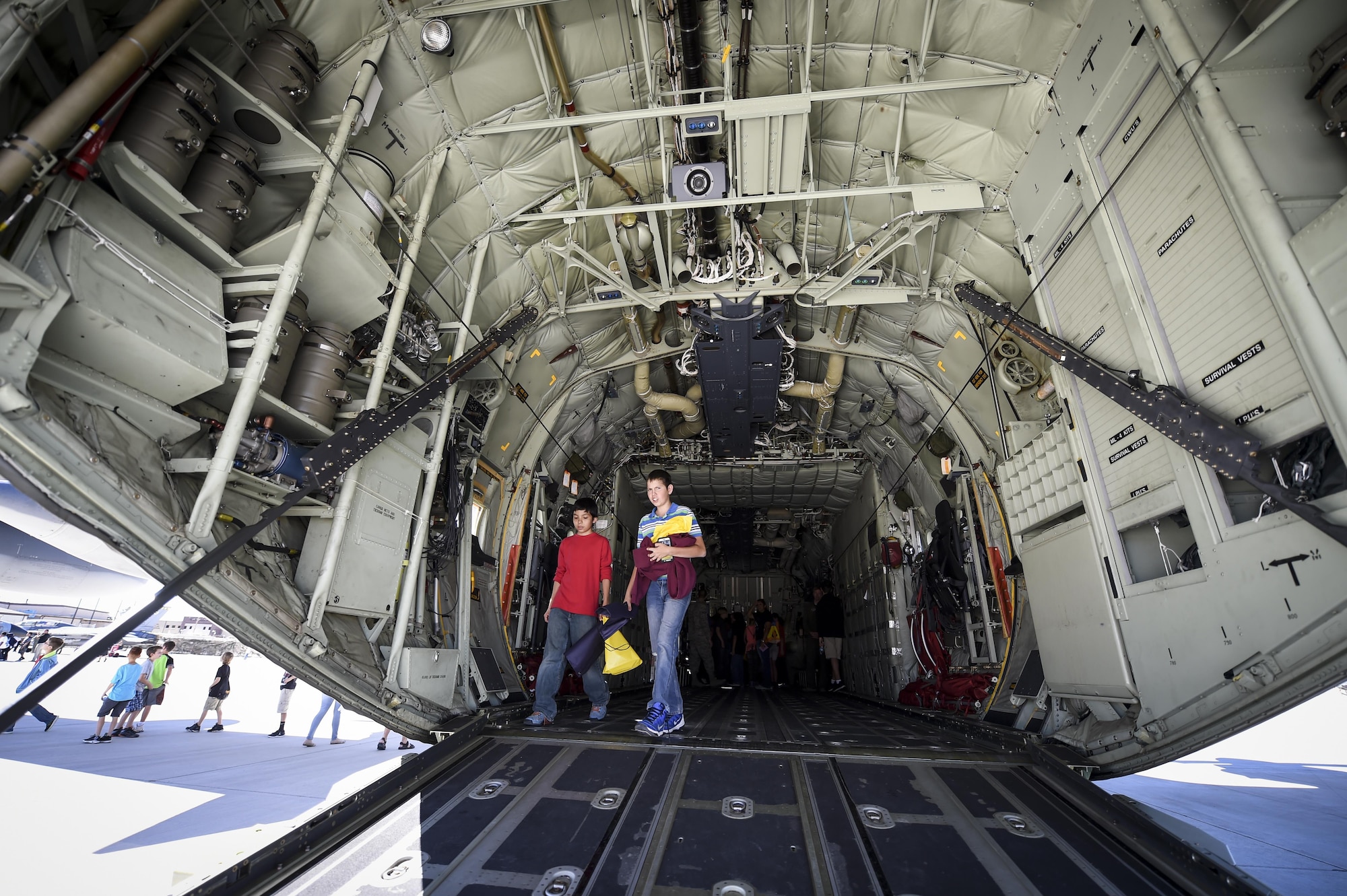 Students tour the interior of a C130 during the fourth annual New Mexico Aviation Aerospace Association Career Expo Oct. 6, 2016 at Holloman Air Force Base N.M. About 2,500 middle school through college-level students from across New Mexico came out to learn about the science, technology, engineering and mathematics fields. The goal of STEM is to motivate and educate students by giving them a taste of what aviation and aerospace engineering is all about. These STEM events also get the students talking to people who are working directly in STEM industries.  (U.S. Air Force photo by Staff Sgt. Stacy Jonsgaard)
