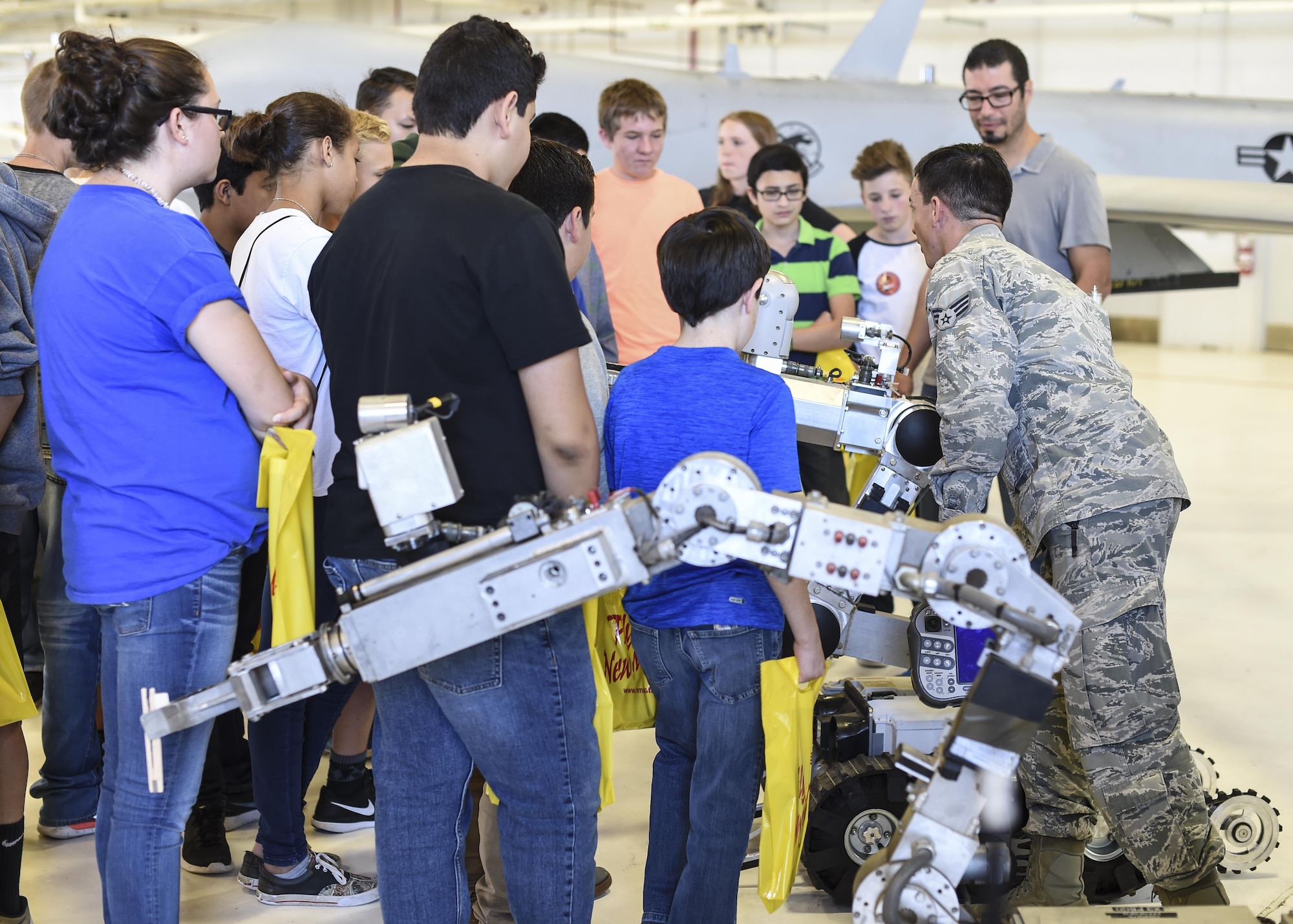 Senior Airman Kevin Oseguera Explosive Ordnance Disposal technician with 49th Civil Engineer squadron demonstrates how what a bomb disposal robot is used for during the fourth annual New Mexico Aviation Aerospace Association Career Expo Oct. 6, 2016 at Holloman Air Force Base N.M. About 2,500 middle school through college-level students from across New Mexico came out to learn about the science, technology, engineering and mathematics fields. The goal of STEM is to motivate and educate students by giving them a taste of what aviation and aerospace engineering is all about. These STEM events also get the students talking to people who are working directly in STEM industries.  (U.S. Air Force photo by Staff Sgt. Stacy Jonsgaard