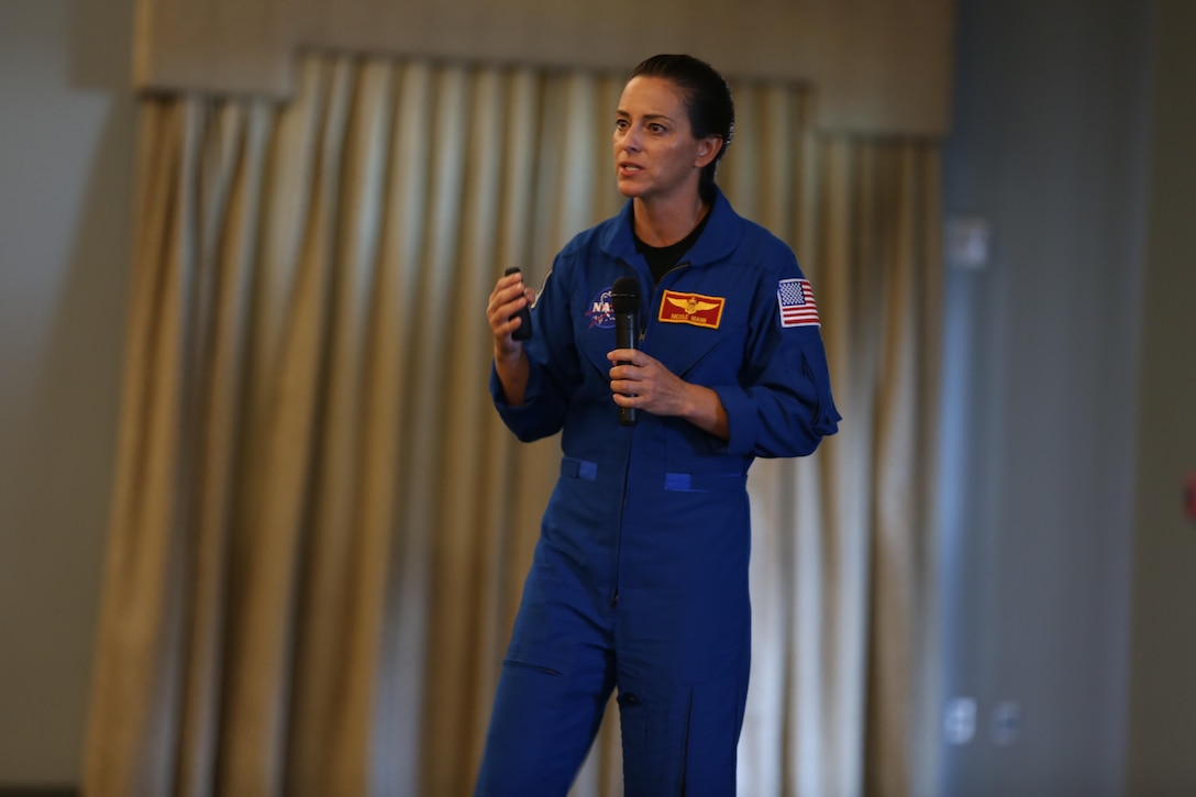Lt. Col. Nicole “Duke” Mann speaks to Marines during a seminar aboard Marine Corps Air Station Cherry Point, N.C., Oct. 11, 2016. The seminar was open to all Marines aboard the air station. Mann covered many topics including her background story, the path she took to become an astronaut, what NASA is accomplishing currently and what the future holds for potential astronauts. “I’ve been to Cherry Point many times, but only when refueling,” said Mann. “It’s amazing to be back around Marines because NASA is a lot different from the Marine Corps. So it’s a breath of fresh air to hang out with some of the Marines here and talk to them about what it takes to become an astronaut.” Mann is currently the Marine Corps’ only active duty astronaut. (U.S. Marine Corps photo by Lance Cpl. Mackenzie Gibson/Released)