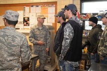 Senior Airman Dominic Vilaubi, 5th Force Support Squadron chef, gives a Dakota Inn dining facility tour to country artist Chase Rice at Minot Air Force Base, N.D., Oct. 8, 2016. Vilaubi explained how the DFAC operates and it’s recent renovations. (U.S Air Force photo/Airman 1st Class Jessica Weissman)