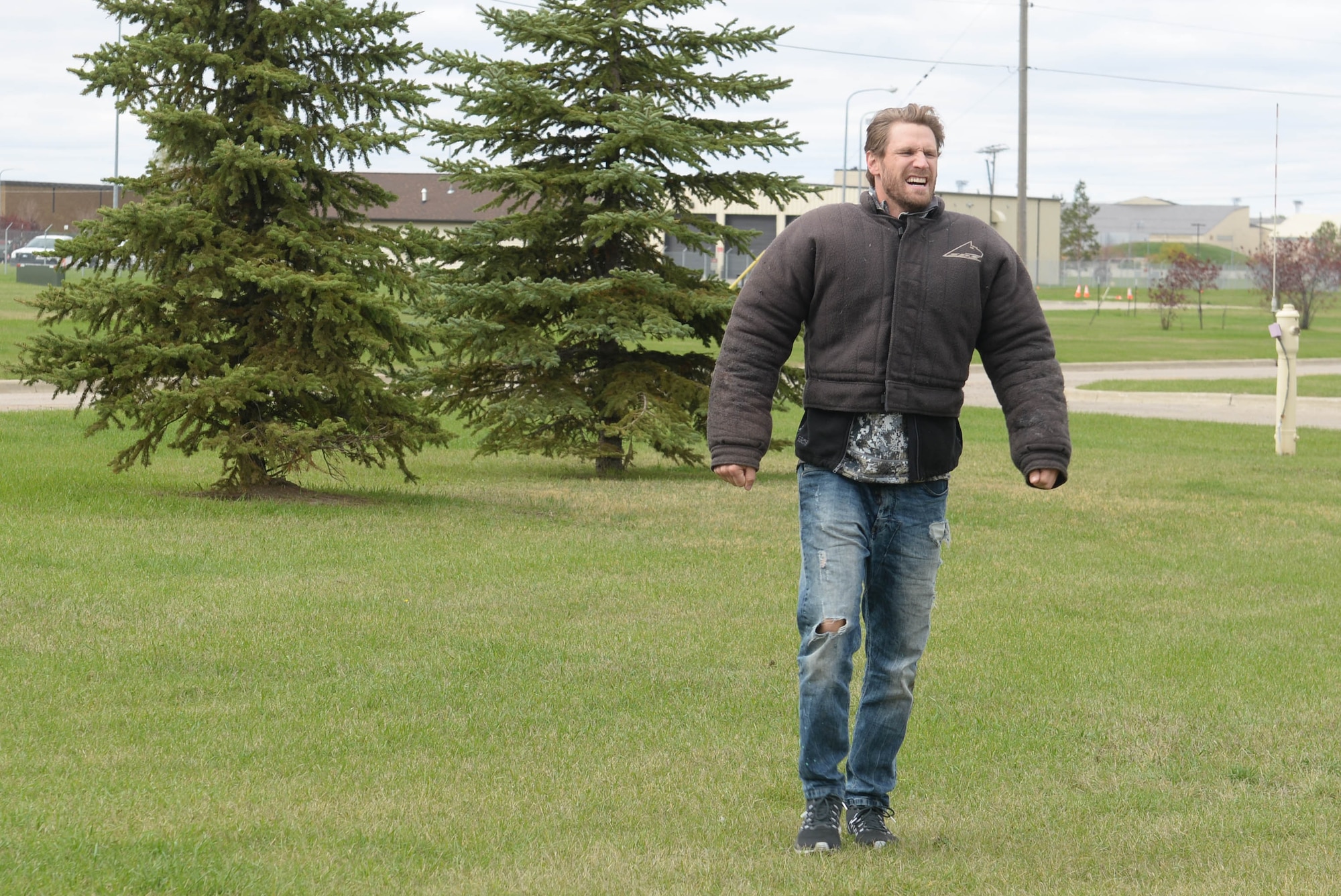 Country artist Chase Rice takes a break after role-playing in a military working dog demonstration at Minot Air Force Base, N.D., Oct. 8, 2016. Rice toured base facilities and hosted a meet-and-greet before his concert in Minot. (U.S Air Force photo/Airman 1st Class Jessica Weissman)