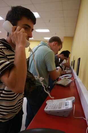 Recruits from Charlie Company, 1st Recruit Training Battalion, make their phone calls home, reading only what is printed on the script in front of them, during receiving at Marine Corps Recruit Depot San Diego, Oct. 11. Recruits will not be able to make another phone call until the end of recruit training. Annually, more than 17,000 males recruited from the Western Recruiting Region are trained at MCRD San Diego. Charlie Company is scheduled to graduate Jan. 6