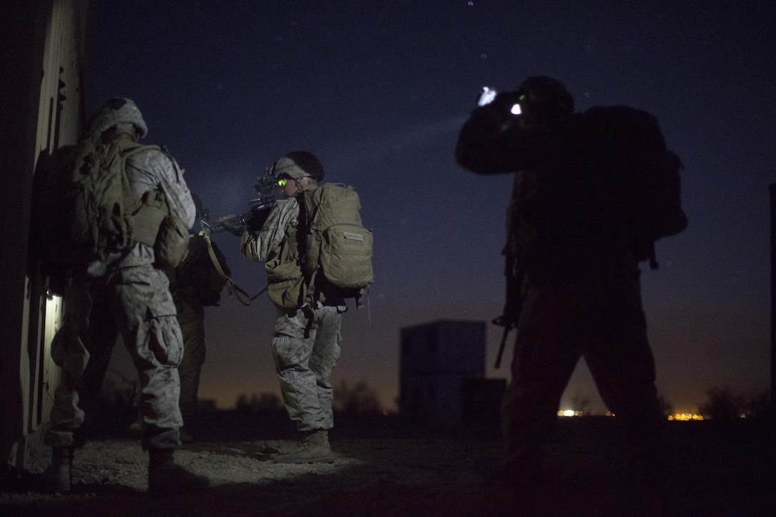 Marines clear buildings during a simulated night raid at Marine Corps Air Station Yuma, Ariz., Oct. 5, 2016, as part of a weapons and tactics instructors course. Marine Corps photo by Cpl. Aaron James Vinculado