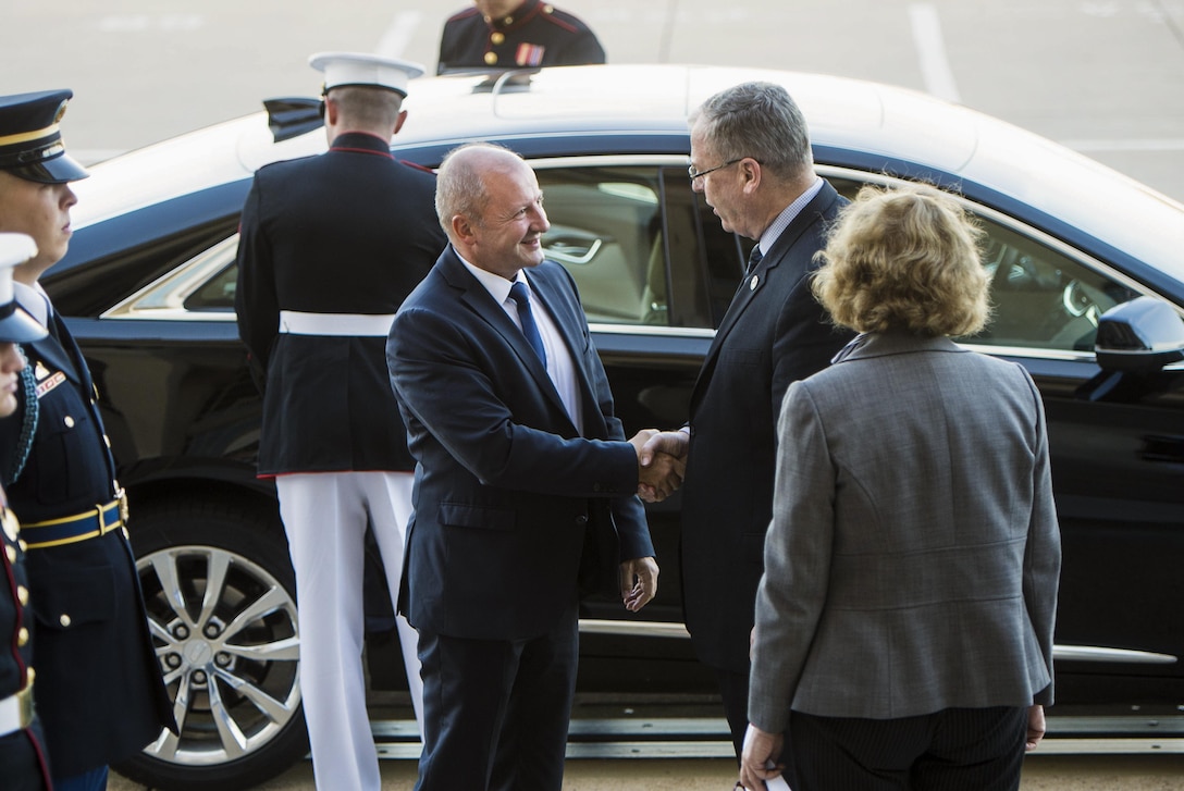 Deputy Defense Secretary Bob Work greets Hungarian Defense Minister Istvan Simicsko at the Pentagon, Oct. 12, 2016. The two leaders met to discuss matters of mutual importance. DoD photo by Navy Petty Officer 1st Class Tim D. Godbee