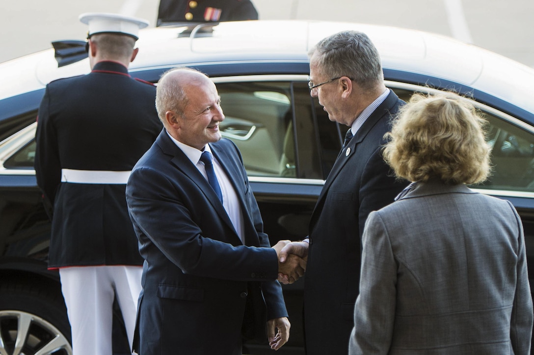 Deputy Defense Secretary Bob Work greets Hungarian Defense Minister Istvan Simicsko at the Pentagon, Oct. 12, 2016. The two leaders met to discuss matters of mutual importance. DoD photo by Navy Petty Officer 1st Class Tim D. Godbee