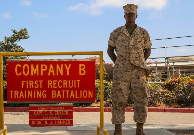 Private First Class Le’Darius S. Scott, Bravo Company, 1st Recruit Training Battalion, stands with his senior drill instructor outside his squad bay at Marine Corps Recruit Depot San Diego, Oct. 11. Following recruit training, Scott will report to the School of Infantry at Marine Corps Base Camp Pendleton, Calif., and then to his military occupational specialty school to become an administration specialist. Annually, more than 17,000 males recruited from the Western Recruiting Region are trained at MCRD San Diego.