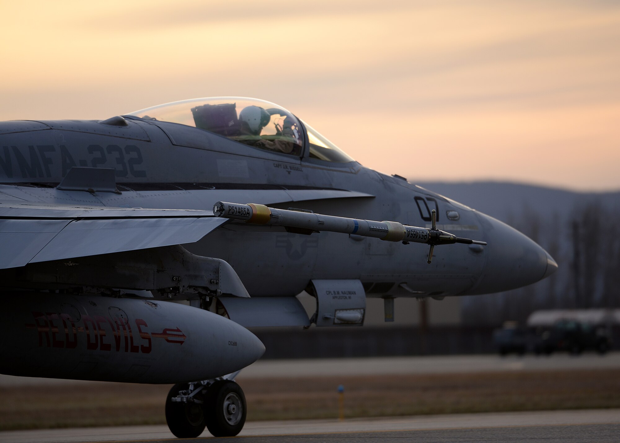 A pilot assigned to Marine Fighter Attack Squadron (VMFA) 232 out of Marine Corps Air Station Miramar, Calif., taxis his F/A-18C Hornet aircraft down the Eielson Air Force Base, Alaska, flight line as the sun rises Oct. 10, 2016, during RED FLAG-Alaska (RF-A) 17-1. RF-A is a series of Pacific Air Forces commander-directed field training exercises for U.S. and partner nation forces, which enables U.S. Marines in units like VMFA-232 to prepare for future combat and contingency operations in a realistic threat environment inside the largest instrumented air, ground and electronic combat training range in the world. (U.S. Air Force photo by Master Sgt. Karen J. Tomasik)