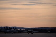 U.S. Marine Corps F/A-18C Hornet aircraft with Marine Fighter Attack Squadron 232 out of Marine Corps Air Station Miramar, Calif., taxi past Republic of Korea F-15K Slam Eagle aircraft as they proceed to the end of the Eielson Air Force Base, Alaska, runway Oct. 10, 2016, for the first RED FLAG-Alaska (RF-A) 17-1 mission. This exercise provides unique opportunities to integrate various forces into joint, coalition and multilateral training from simulated forward operating bases. (U.S. Air Force photo by Master Sgt. Karen J. Tomasik)