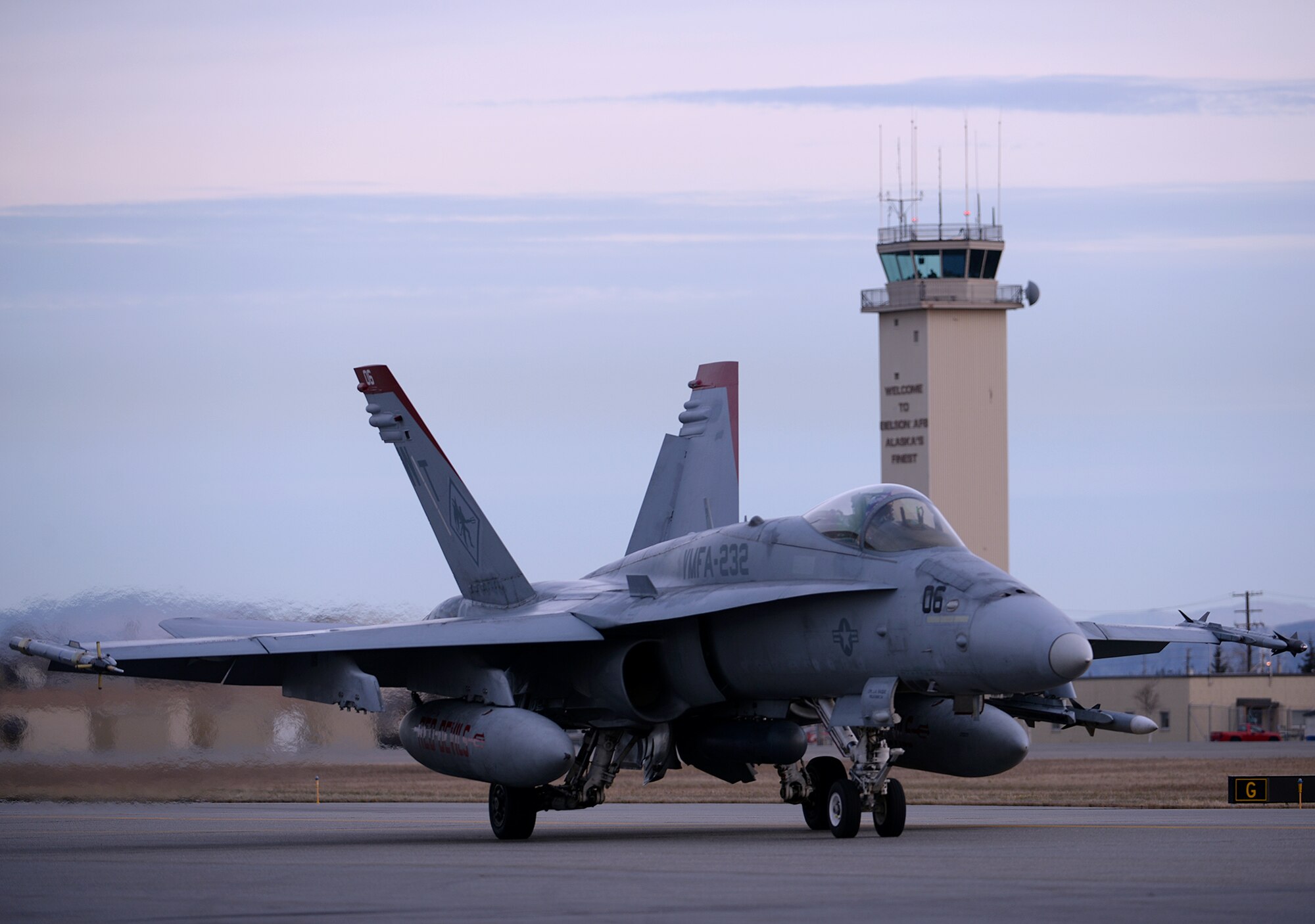A U.S. Marine Corps F/A-18C Hornet aircraft with Marine Fighter Attack Squadron (VMFA) 232 out of Marine Corps Air Station Miramar, Calif., taxis past the Eielson Air Force Base, Alaska, air traffic control tower Oct. 10, 2016, in preparation for the first RED FLAG-Alaska (RF-A) 17-1 mission. RF-A is a series of Pacific Air Forces commander-directed field training exercises for U.S. and partner nation forces, which enables U.S. Marines in units like VMFA-232 to prepare for future combat and contingency operations in a realistic threat environment inside the Joint Pacific Alaska Range Complex. (U.S. Air Force photo by Master Sgt. Karen J. Tomasik)
