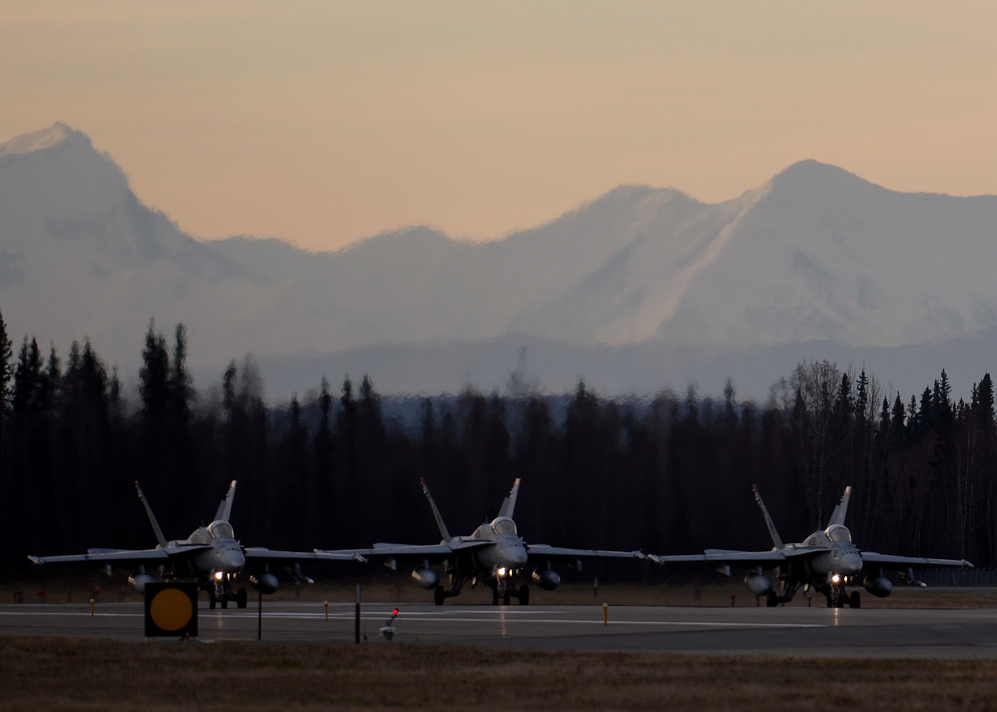 U.S. Marine Corps F/A-18C Hornets assigned to Marine Fighter Attack Squadron (VMFA) 232 out of Marine Corps Air Station Miramar, Calif., line up at the end of the Eielson Air Force Base, Alaska, runway Oct. 10, 2016, for the first combat training mission of RED FLAG-Alaska (RF-A) 17-1. RF-A is a series of Pacific Air Forces commander-directed field training exercises for U.S. and partner nation forces, which enables U.S. Marines in units like VMFA-232 to prepare for future combat and contingency operations in a realistic threat environment inside the largest instrumented air, ground and electronic combat training range in the world. (U.S. Air Force photo by Master Sgt. Karen J. Tomasik)