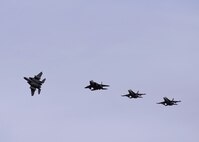 A U.S. Air Force F-15 Eagle assigned to the 44th Fighter Squadron out of Kadena Air Base, Japan, breaks away from a formation with another F-15 and two U.S. Marine Corps F/A-18C Hornet aircraft assigned to Marine Fighter Attack Squadron 232 out of Marine Corps Air Station Miramar, Calif., as they return to Eielson Air Force Base, Alaska, Oct. 10, 2016, after the first RED FLAG-Alaska (RF-A) 17-1 combat training mission. RF-A exercises enable joint and international units to sharpen their skills and build interoperability by flying simulated combat sorties in a realistic threat environment inside the largest instrumented air, ground and electronic combat training range in the world. (U.S. Air Force photo by Master Sgt. Karen J. Tomasik)