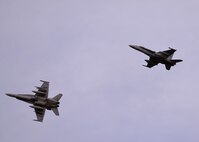A pair of U.S. Marine Corps F/A-18C Hornet aircraft assigned to Marine Fighter Attack Squadron (VMFA) 232 out of Marine Corps Air Station Miramar, Calif., returns to Eielson Air Force Base, Alaska, Oct. 10, 2016, after the first RED FLAG-Alaska (RF-A) 17-1 combat training mission. RF-A is a series of Pacific Air Forces commander-directed field training exercises for U.S. and partner nation forces, enabling joint and international units like VMFA-232 to sharpen their skills and build interoperability by flying simulated combat sorties in a realistic threat environment inside the largest instrumented air, ground and electronic combat training range in the world. (U.S. Air Force photo by Master Sgt. Karen J. Tomasik)