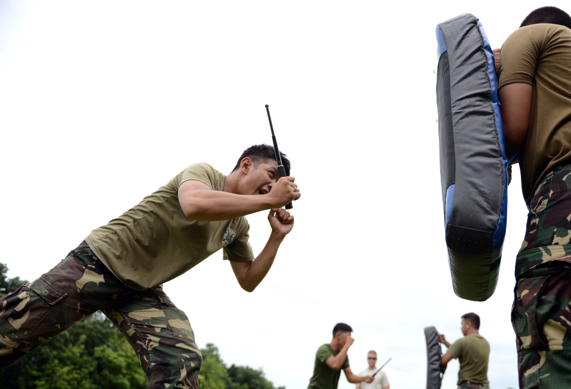 A Philippine Air Force military police office participates in baton practice, a nonlethal means of subduing an aggressor, during a subject matter expert exchange with the United States as part of the current iteration of U.S. Pacific Command’s Air Contingent at Brigadier General Benito N Ebuen Air Base, Lapu-Lapu City, Philippines, Oct. 4, 2016. The Air Contingent is helping build the capacity of the Philippine Air Force and increases joint training, promotes interoperability and provides greater and more transparent air and maritime situational awareness to ensure safety for military and civilian activities in international waters and airspace. Its missions include air and maritime domain awareness, personnel recovery, combating piracy, and assuring access to the air and maritime domains in accordance with international law. (U.S. Air Force photo by Capt. Mark Lazane)