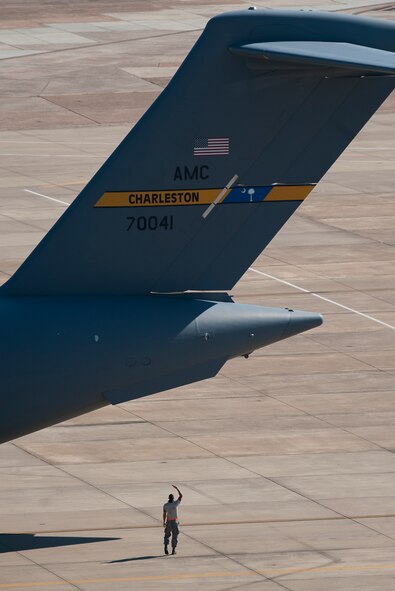 An Airman inspects a C-17 Globemaster III at Barksdale Air Force Base, La., Oct. 6, 2016. More than 100 aircraft from Shaw Air Force Base, S.C., Joint Base Charleston, S.C., and Seymour Johnson Air Force Base, N.C., were relocated to avoid potential damage from Hurricane Matthew along the East Coast. (U.S. Air Force photo/Airman Alexis C. Schultz)